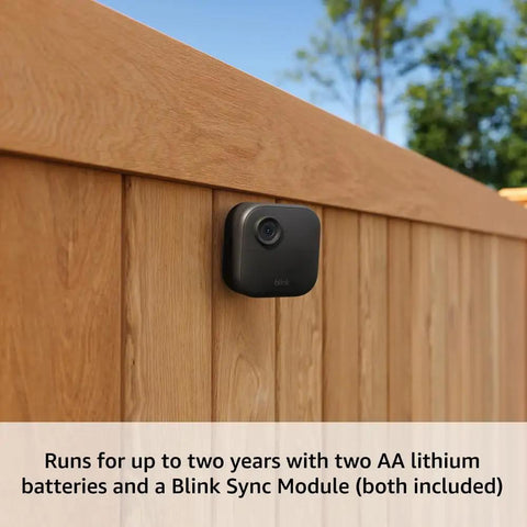 Outdoor 4 Wireless Security Camera System With Two Year Battery Life mounted on wooden fence