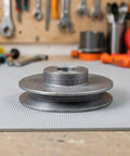 Super Cool Single Groove V Belt Pulley With 4 Inch Outer Diameter And 19 Millimeter Bore Made From Cast Metal For Air Compressors Easy Swap And Smooth Drive Shaft Rotation Perfect Machine Part Fit on a workbench.