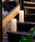 Huge Outdoor Flameless LED Pillar Candles 4X10 Inches IP44 Waterproof with Remote on wooden stairs