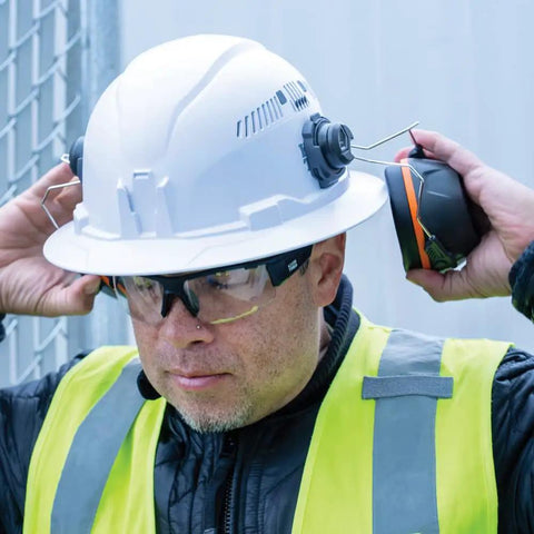 Worker wearing Ear Muffs With Full Brim Hard Hat Attachment For Construction And Manufacturing Pros On The Jobsite, 26 Decibels NRR