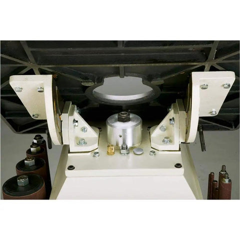 Powerful One Horsepower Oscillating Spindle Sander Featuring Rock Solid Cast Iron Table And Roomy Four Inch Dust Port. Close-up of base and spindle assembly.