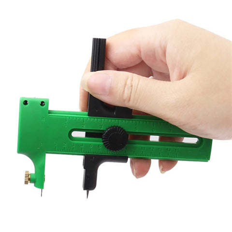 Hand holding Double Stage Adjustable Rotary Compass Circle Cutter for paper cardboard rubber vinyl leather craft projects in green