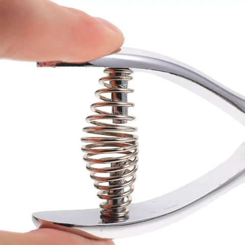 Close-up of spring mechanism in Oval Hole Puncher Handheld Manual Metal Card Punch Tool for Office and Home Eight Sheets Solid Build