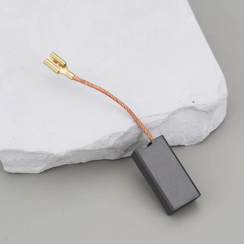Single black motor carbon brush with copper wire connector for Hilti power tools, 7x12.5x25mm size.