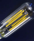 Close-up of Dimmable LED Filament Candle Bulb 60W Equivalent For Chandeliers And Sconces 4000K Daylight White Clear Glass