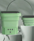 Ultra Portable Folding Washing Machine in green, compact size with control panel, suitable for travel and small spaces.