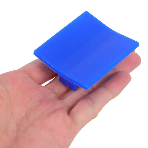 Hand holding blue plastic puller from 4 Piece Auto Dent Repair Kit With Plastic Puller Tabs And Heavy Duty Sheet Metal Expander