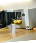 Heavy Duty Steel U Shaped Mounting Braces For Commercial Ovens And Cabinetry against a kitchen backdrop near a microwave.