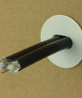 Skywalker white dual feed-through cable bushing with two black cables and exposed conductors
