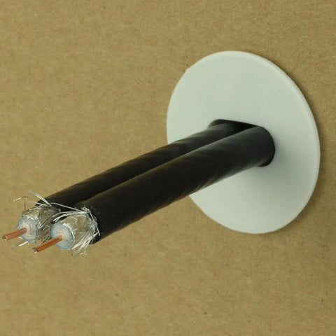 Skywalker white dual feed-through cable bushing with two black cables and exposed conductors