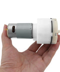 12V Micro Vacuum Pump for Aquarium Oxygen, Whisper Quiet DC Air Pump with 15 L/Min Flow held in hand for size reference