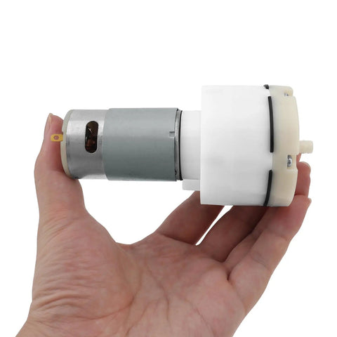 12V Micro Vacuum Pump for Aquarium Oxygen, Whisper Quiet DC Air Pump with 15 L/Min Flow held in hand for size reference