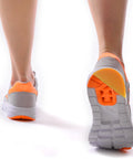 Runner wearing sneakers with Bevel Design Rubber Heel Patch Kit For Shoes With Anti Slip Patches 2 Pairs Heel Lifts installed.
