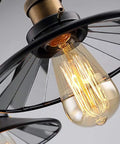 Close-up of bulb in Industrial Vintage 3 Light Semi Flush Ceiling Mount Fixture, retro metal design, black finish.