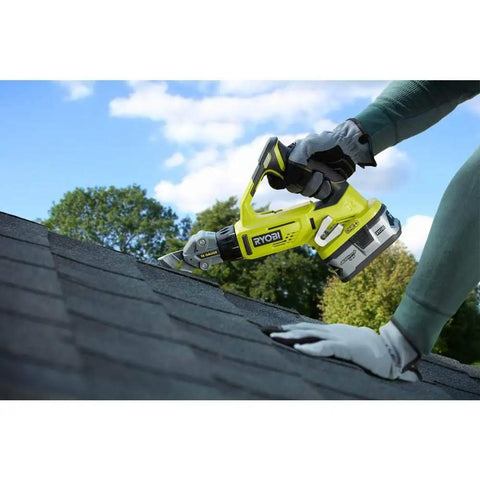 18V 18-Gauge Offset Shear Tool Only P591 cutting shingles on a roof, showing lightweight design and precision cutting ability