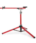 Red Sprint Bike Repair Stand with tripod base and dropout style mount, built for road, mountain, cyclocross, and triathlon bikes.