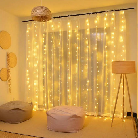 9.8 By 9.8 Feet 300 LED Curtain Lights With USB Plug, Waterproof IP44 Fairy String Lights illuminating a cozy indoor room.