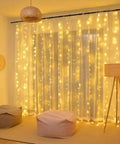 300 LED Fairy Curtain Lights USB Plug In 9.8 By 9.8 Feet Warm White With 8 Modes Indoor Outdoor Waterproof IP44 hanging in a cozy room