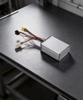 H5 Electric Scooter Controller 18A Mainboard With Aluminum Alloy Case on a workbench, showing wires and connectors