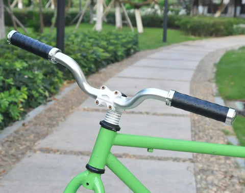 Grippy Leather Double Lock On Bike Grips 22.2mm For Mountain And Road Bikes on silver handlebars, aluminum clamp visible