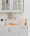 Modern kitchen with Meadows Greek Revival Light Switch Cover Plate With Old School Vibe near sink and utensils.
