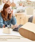 Woman working at desk with PU Leather Desk Organizer Caddy With Two Compartments Remote Control Holder Pencil Cup Makeup Brush Holders All In One Multifunctional Desktop Organizer For Home Office And School.