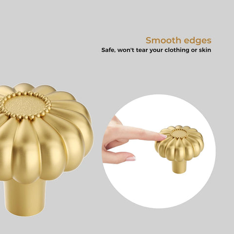 Close-up of 8 Pack Gold Brushed Brass Cabinet Knob with smooth edges, decorative solid zinc alloy handle, and finger pointing at knob.
