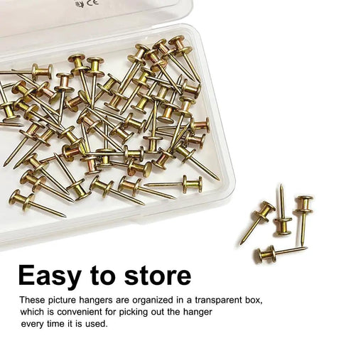 Heavy Duty Double Headed Picture Hangers And Thumb Tacks Pack Of Fifty Pieces For Hassle Free Wall Mounting With A Rock Solid Grip organized in a transparent box.