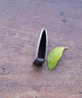 New Dope Habaki Collar Alloy Or Copper 01 22 Fit Katana Wakizashi Tanto. Side view of collar next to leaf for size reference.