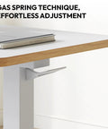 Overbed Table With Pneumatic Lift, Adjustable Height 26 To 41.7 Inches, Hidden Casters, Mobile Laptop Desk With Tray, showing gas spring adjustment.