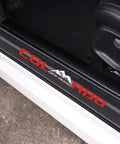 Four Piece Reflective Car Door Sill Protectors Chevy Colorado Off Road Carbon Fiber Scuff Plates showing red design detail on black surface