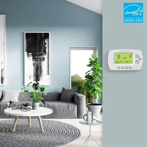 Smart 7-Day Wi-Fi Programmable Thermostat With Energy Star Rating installed in modern living room setting.