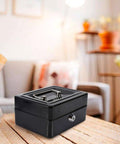 Compact Lock Box For Cash And Jewelry Storage, Lockable Small Black Safe With Key For Home And Office Security on wooden table