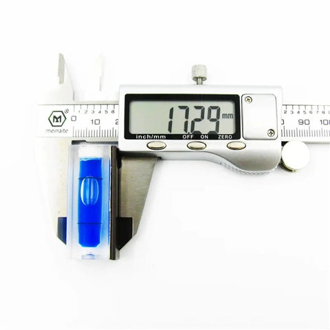 1pcs 15 * 15 * 40mm Square Column Water Level Meter Spirit Level Bubble next to caliper measuring 17.29mm.