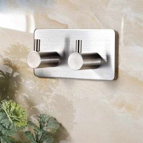 Heavy Duty Stainless Steel Wall Mounted Hooks Featuring Super Strong Self Adhesive Tape For Bathroom Towels Coats And Home Organization No Drill Hassle Rust Proof Daily Setup on smooth wall.