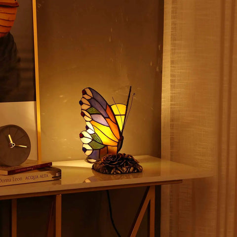 Butterfly Tiffany Style Stained Glass Accent Table Lamp Night Light illuminating a room with a cozy warm white glow, 8x5x9 inches.