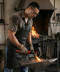 Blacksmith using 40 Oz Blacksmith Hammer For Metalworking And Welding With Shock Absorbing Anti Slip Fiberglass Handle And Forged Steel Head