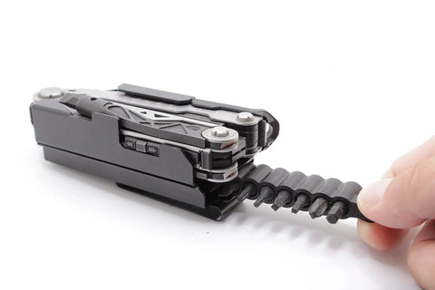 Center-Drive Multitool Sheath with Quick Draw Retention and Bit Kit Pocket shown with hand accessing bits.