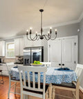 Six Light Black Modern Farmhouse Chandelier With Rustic Vintage Candle Iron Arms in dining room setting