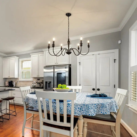 Six Light Black Modern Farmhouse Chandelier With Rustic Vintage Candle Iron Arms in dining room setting