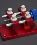 Beefy Aluminum Work Holder With Anodized Red Finish And Knurled Blue Adjustment Knob A Solid Workshop Tool For Securely Holding Parts And Precise Repairs Heavy Duty Aluminum Alloy Build For Everyday Shop Use, red aluminum work holder with blue knob
