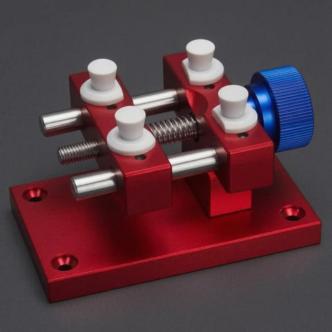 Beefy Aluminum Work Holder With Anodized Red Finish And Knurled Blue Adjustment Knob A Solid Workshop Tool For Securely Holding Parts And Precise Repairs Heavy Duty Aluminum Alloy Build For Everyday Shop Use, red aluminum work holder with blue knob