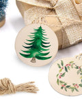 Thirty Pack Fresh Three Inch Round Blank Wood Circles With Natural Twine Hangers Premium Birch Plywood Crafting Pendants with painted tree and wreath.