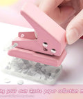Close-up of a pink mini hole punch creating 6mm circle holes, part of a 2 Pack Mini Hole Punch 6mm Circle Holes Ultra Compact set
