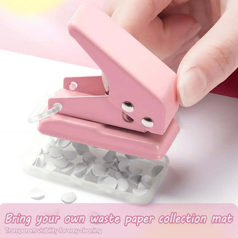 Close-up of a pink mini hole punch creating 6mm circle holes, part of a 2 Pack Mini Hole Punch 6mm Circle Holes Ultra Compact set
