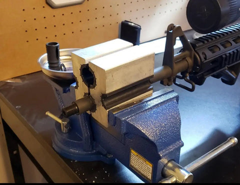 Universal Barrel Clamp For Firearms, Aircraft Grade Aluminum Vise Grip With Non Marring Urethane Lining in use