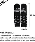 Black socks with 'It's An Engineer Thing You Wouldn't Understand' text, images of tools, 12.8x3.5 inch size, cotton blend.