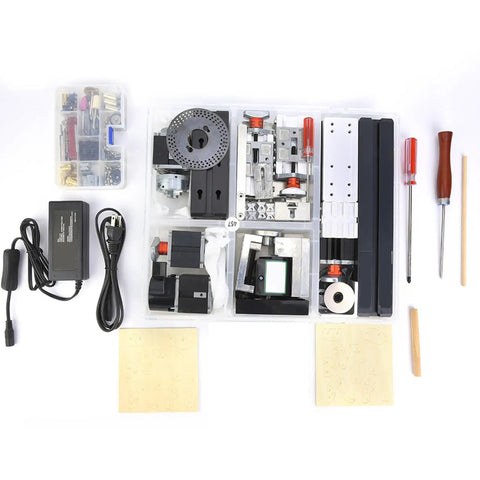 Collection of components and tools for FTVOGUE Z8000M Mini Lathe, including motor, clamps, and adapters in clear storage box.