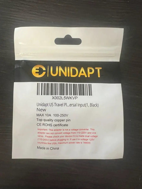 Package of Global Travel Plug Adapter To USA Type B Grounded 3 Prong Wall Plug Converter, labeled Unidapt.