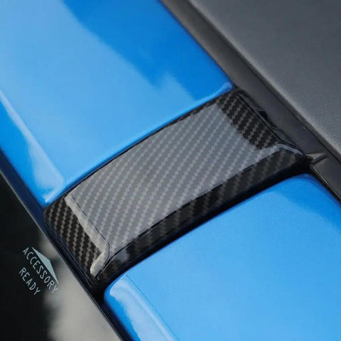 Slick Carbon Fiber Screw Protector Covers For Ford Bronco And Raptor Exterior Roof Trim Caps on blue surface.
